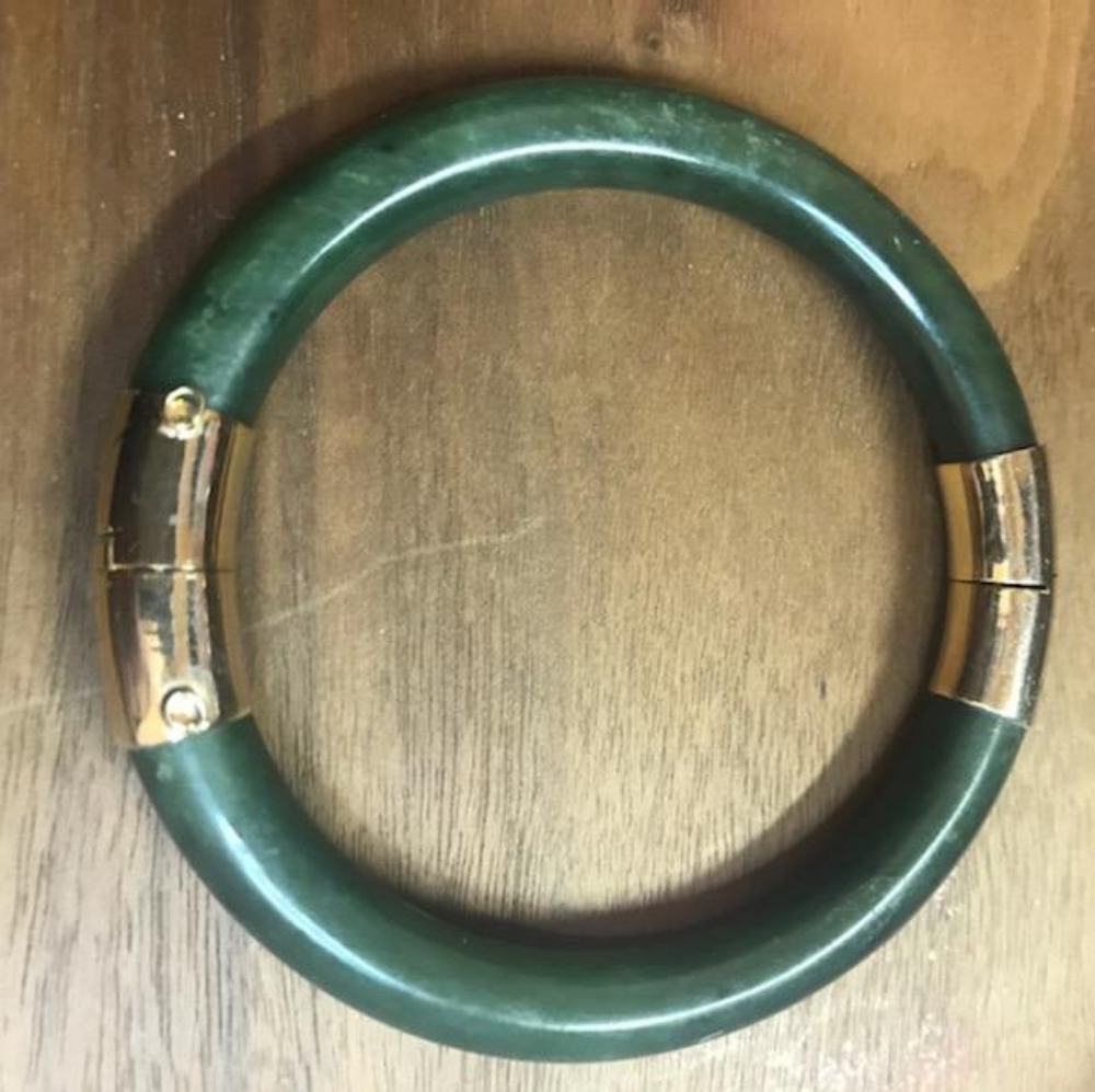 Rare vintage lucky jade bangle with goldtone hardware.